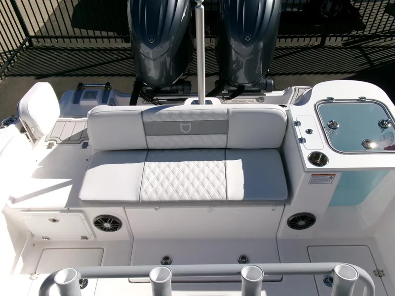 Slide: The Image of 2025 Sea Fox 268 Commander boat interior with cushioned seating and dual engines. - 33