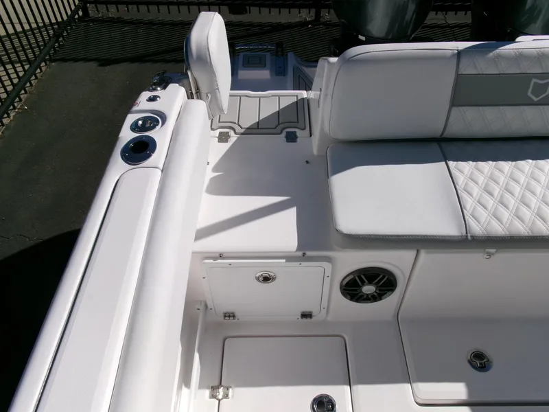 Slide: The Image of 2025 Sea Fox 268 Commander boat interior with white seating and storage compartments. - 34
