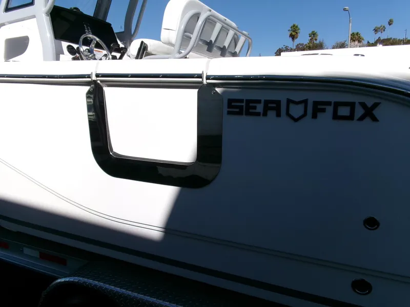 Slide: The Image of 2025 Sea Fox 268 Commander boat side view with logo and seating. - 43