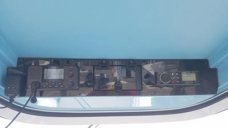 Slide: The Image of Control panel of a 2018 Edgewater 320 CC boat with Garmin and Fusion electronics. - 10
