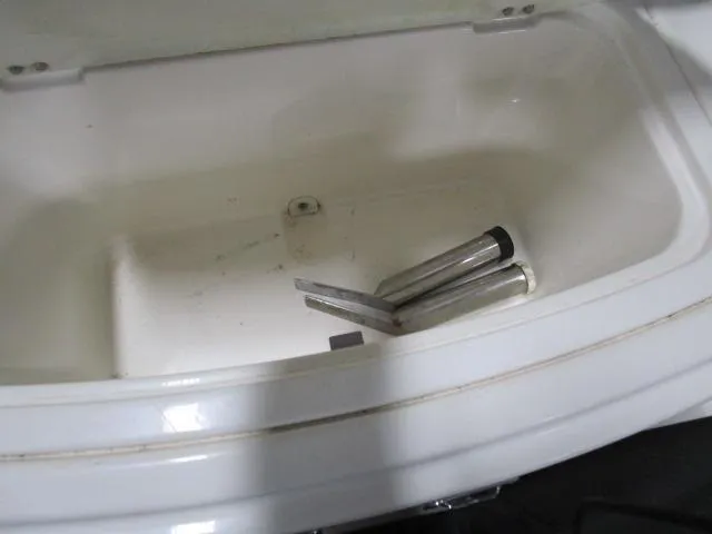 Slide: The Image of 2017 Larson 292 LXI boat compartment with metal parts inside. - 14