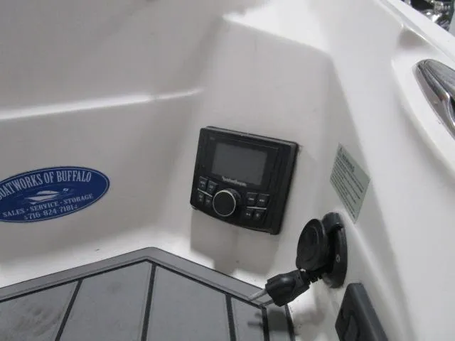 Slide: The Image of Control panel on a 2017 Larson 292 LXI boat interior. - 23