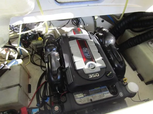 Slide: The Image of Engine compartment of a 2017 Larson 292 LXI boat, featuring a 6.2L 350 horsepower engine. - 35