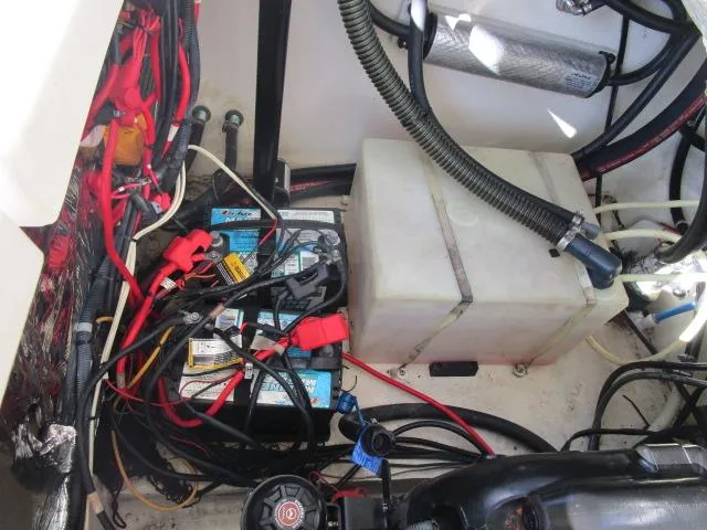 Slide: The Image of Engine compartment of 2017 Larson 292 LXI with battery and wiring. - 36