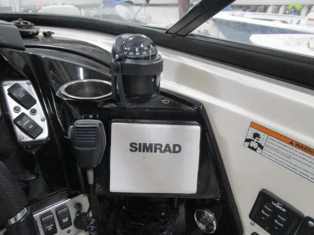 Slide: The Image of Control panel of 2017 Larson 292 LXI boat with Simrad navigation system. - 8