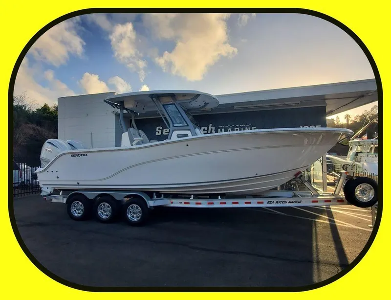 Slide: The Image of 2025 Sea Fox 288 Commander boat on trailer, parked outdoors. - 1