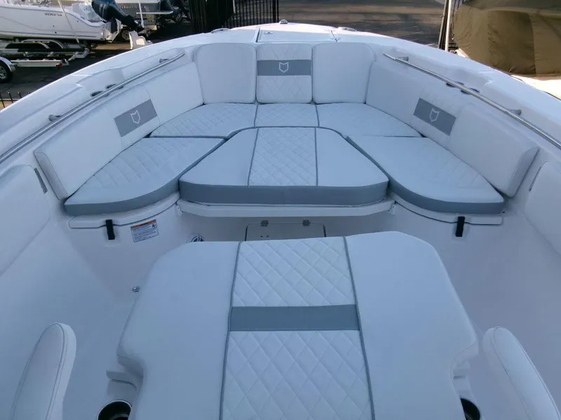 Slide: The Image of 2025 Sea Fox 288 Commander boat interior with cushioned seating and modern design. - 10