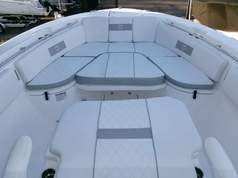 Slide: The Image of 2025 Sea Fox 288 Commander boat interior with cushioned seating and modern design. - 11