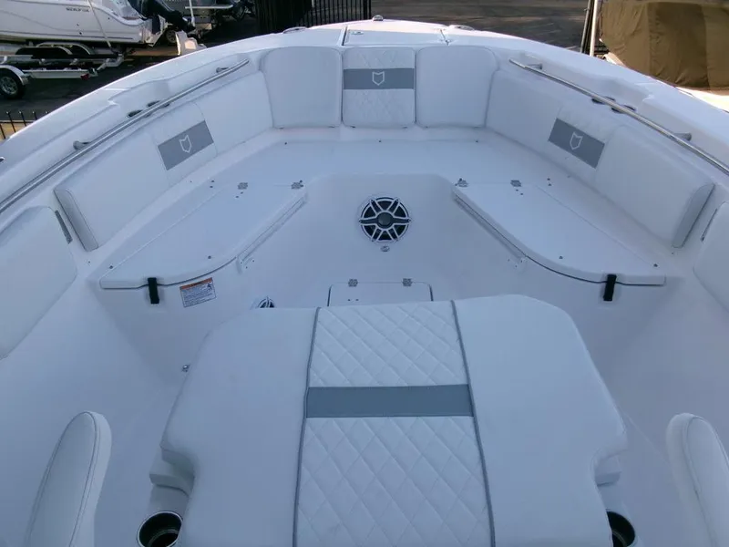 Slide: The Image of 2025 Sea Fox 288 Commander boat interior with white cushioned seating. - 13
