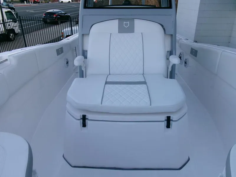 Slide: The Image of 2025 Sea Fox 288 Commander boat interior with white cushioned seating. - 16