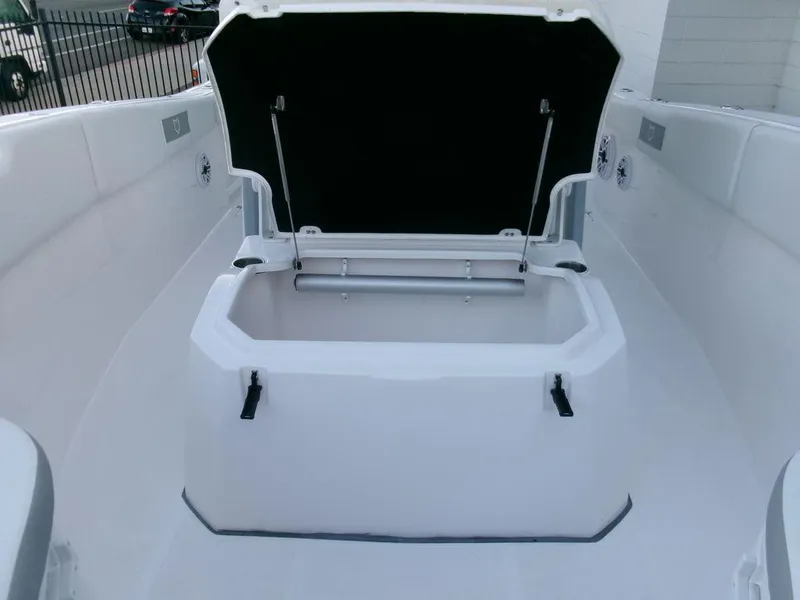Slide: The Image of 2025 Sea Fox 288 Commander boat storage compartment open on deck. - 17