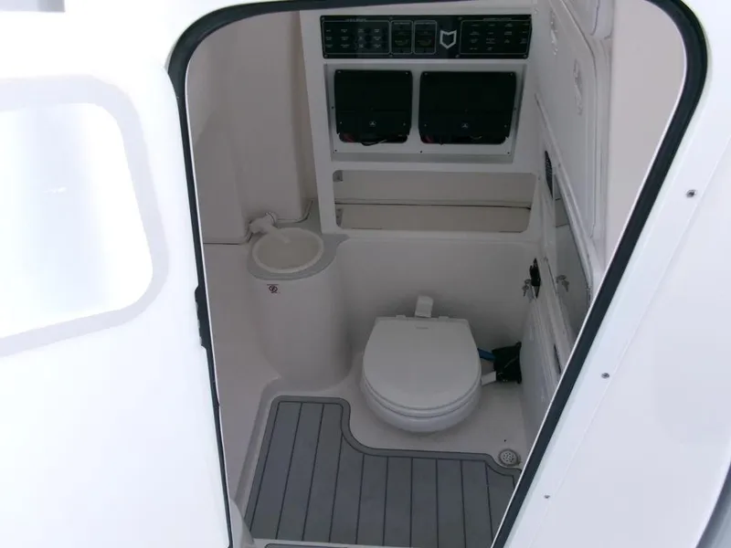 Slide: The Image of 2025 Sea Fox 288 Commander boat interior bathroom with toilet and sink. - 22