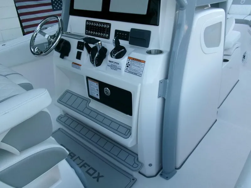 Slide: The Image of 2025 Sea Fox 288 Commander boat cockpit with steering wheel and control panel. - 24