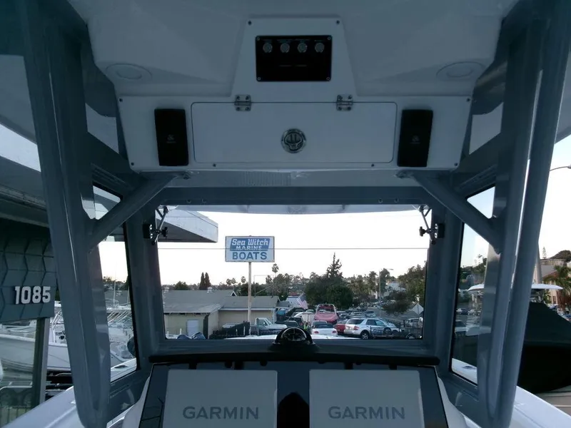 Slide: The Image of 2025 Sea Fox 288 Commander boat interior with Garmin displays and Sea Witch Boats sign. - 25