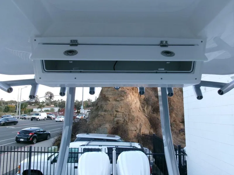 Slide: The Image of 2025 Sea Fox 288 Commander boat with rod holders and storage compartment. - 26