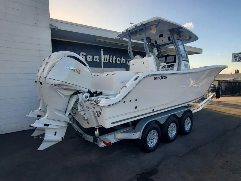 Slide: The Image of 2025 Sea Fox 288 Commander boat on trailer, featuring dual Yamaha engines. - 3