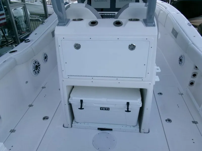 Slide: The Image of 2025 Sea Fox 288 Commander boat interior with Yeti cooler and storage compartment. - 32