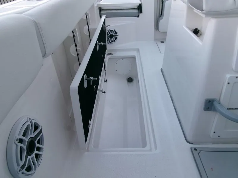 Slide: The Image of 2025 Sea Fox 288 Commander interior with storage compartment and speakers. - 35