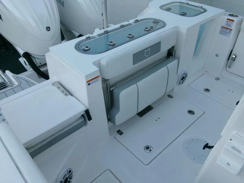 Slide: The Image of 2025 Sea Fox 288 Commander boat interior with seating and storage compartments. - 38