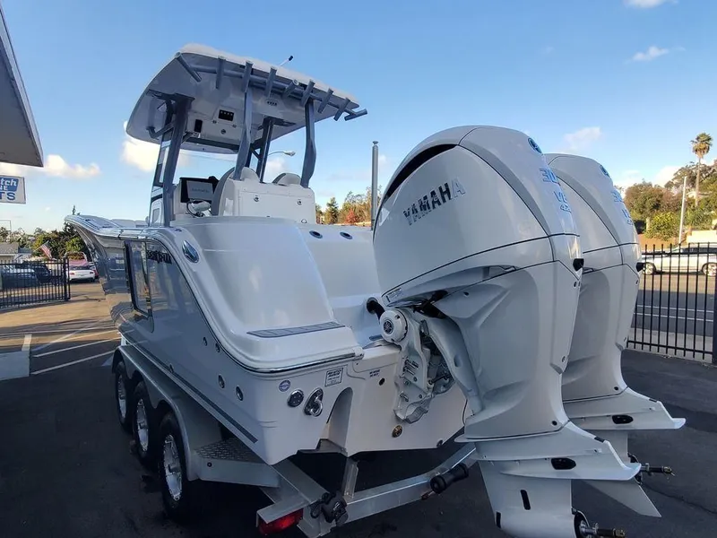 Slide: The Image of 2025 Sea Fox 288 Commander boat with dual Yamaha engines on a trailer. - 4