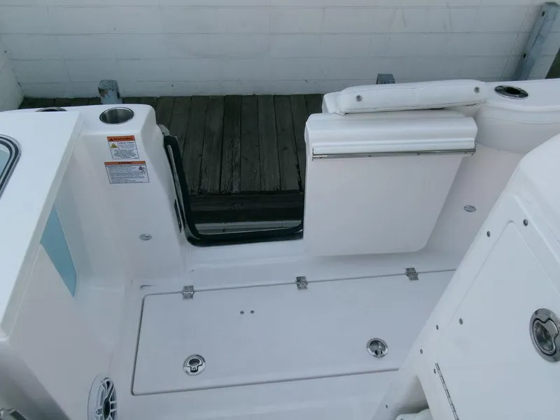 Slide: The Image of 2025 Sea Fox 288 Commander boat interior with white seating and deck details. - 44