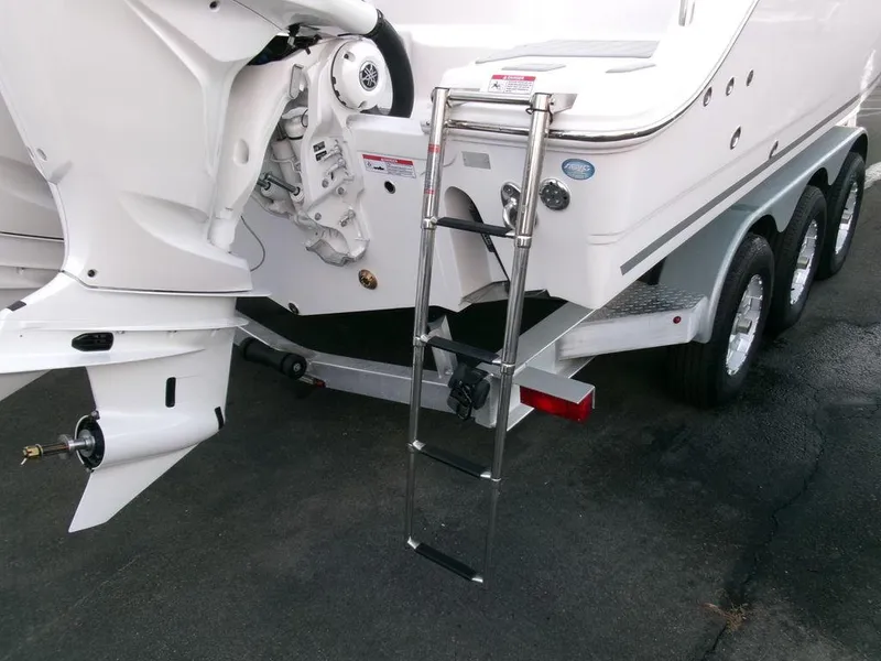 Slide: The Image of 2025 Sea Fox 288 Commander boat with ladder and triple-axle trailer. - 46