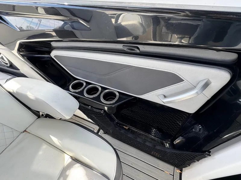 Slide: The Image of 2023 Yamaha Boats 252SD interior with sleek seating and cup holders. - 13