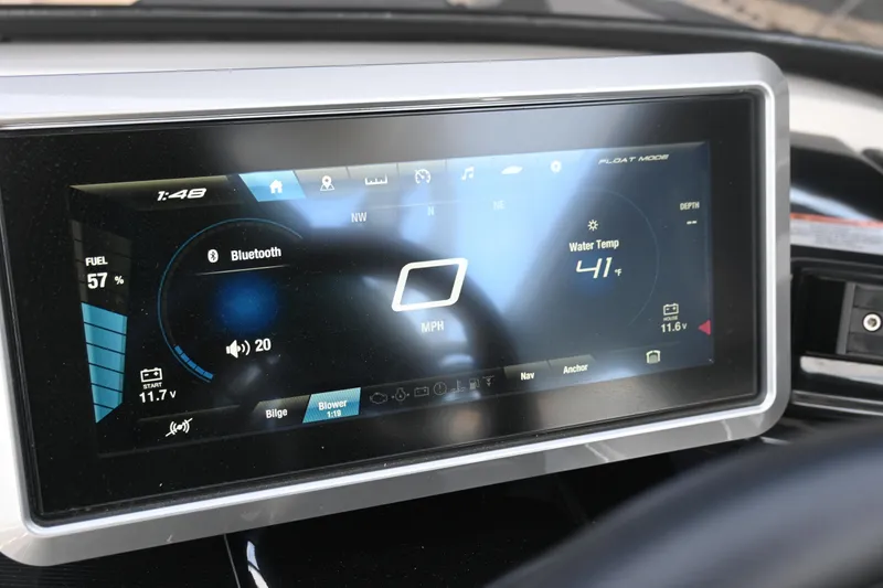 Slide: The Image of 2023 Yamaha Boats 252SD dashboard display with speed, Bluetooth, and water temperature indicators. - 24