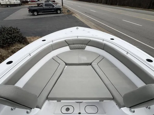 Slide: The Image of 2025 Sportsman Heritage 261 boat with spacious seating and sleek design. - 17