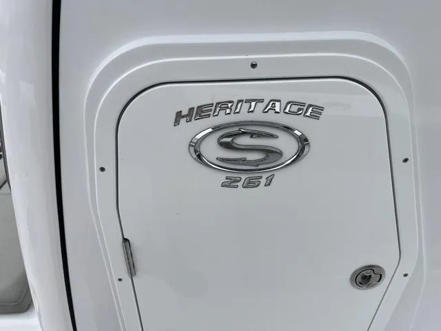 Slide: The Image of 2025 Sportsman Heritage 261 boat emblem on a white surface. - 21