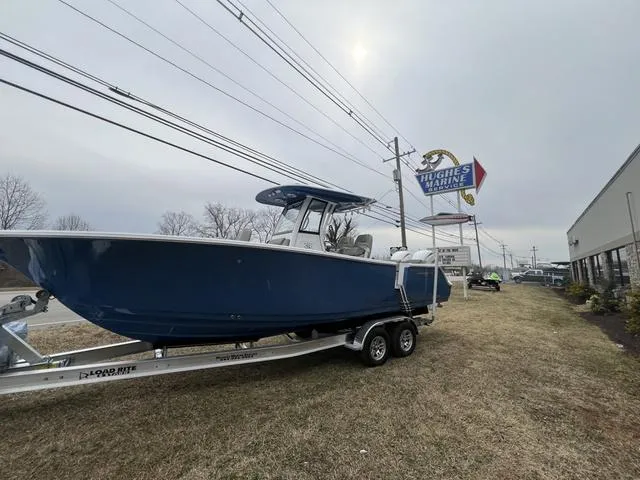 Slide: The Image of 2025 Sportsman Heritage 261 boat on trailer at Hughes Marine dealership. - 23