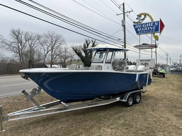 Slide: The Image of 2025 Sportsman Heritage 261 boat on trailer at Hughes Marine Service. - 25