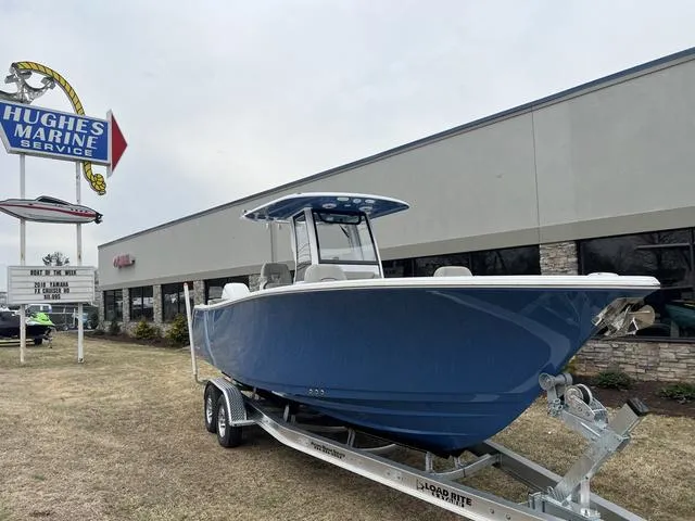 Slide: The Image of 2025 Sportsman Heritage 261 boat on trailer at Hughes Marine Service. - 26