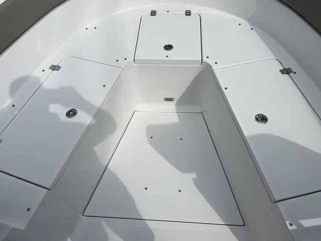 Slide: The Image of 2025 Sportsman Heritage 261 boat interior with storage compartments. - 28