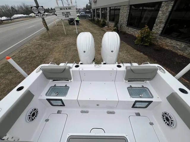 Slide: The Image of 2025 Sportsman Heritage 261 boat with dual engines, spacious deck, and modern design. - 4