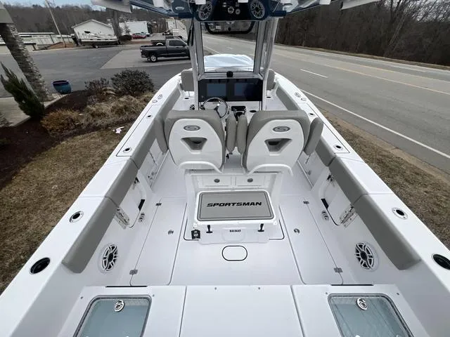 Slide: The Image of 2025 Sportsman Heritage 261 boat interior with seating, console, and storage compartments. - 5