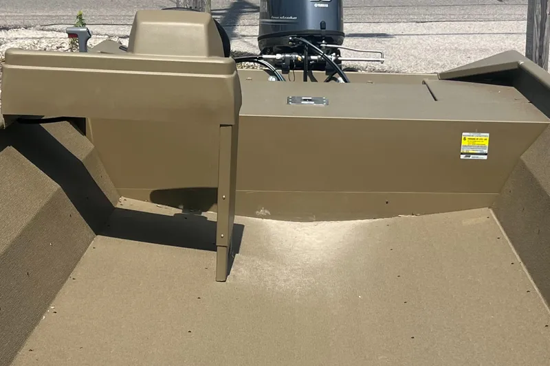 Slide: The Image of 2025 G3 Gator Tough 1860 VBW boat interior with motor, beige finish. - 4