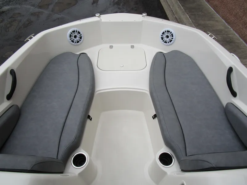 Slide: The Image of 2022 Stingray 182 boat interior with gray seating and cup holders. - 11