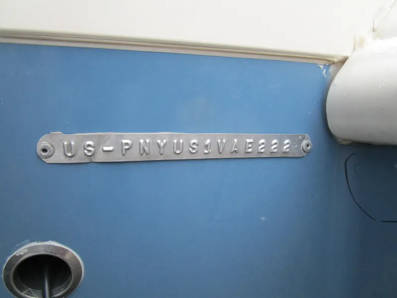 Slide: The Image of 2022 Stingray 182 boat hull identification number on blue surface. - 17