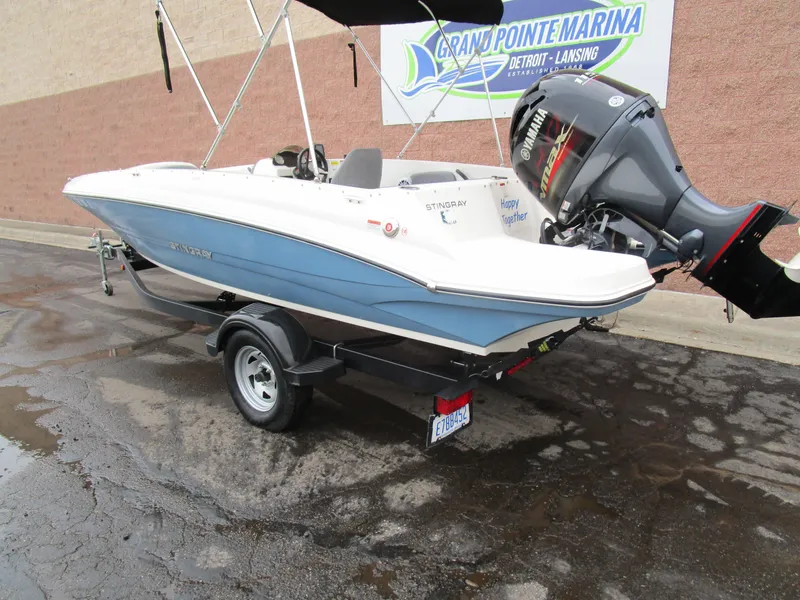 Slide: The Image of 2022 Stingray 182 boat on trailer at Grand Pointe Marina. - 2