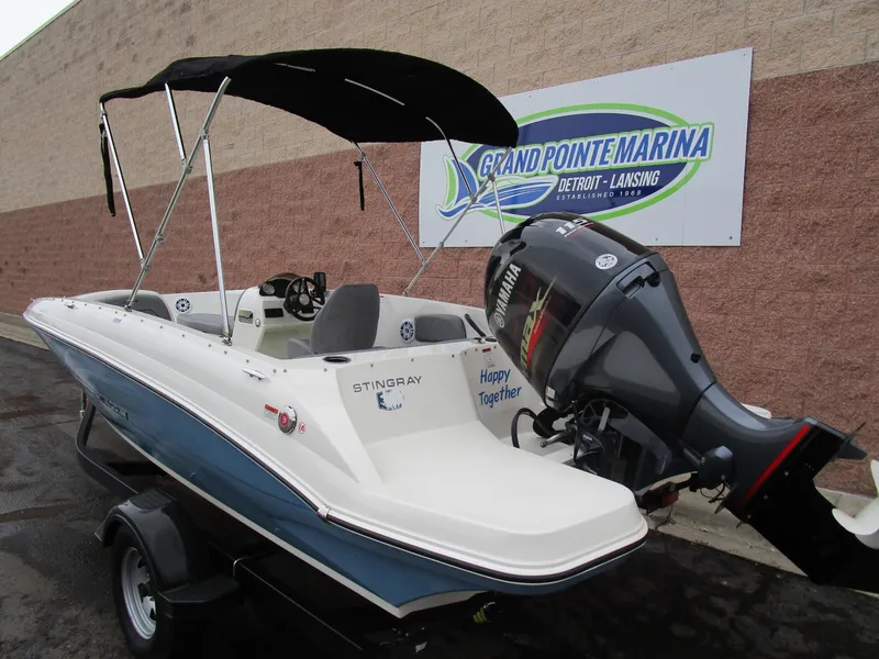 Slide: The Image of 2022 Stingray 182 boat with outboard motor at Grand Pointe Marina. - 3