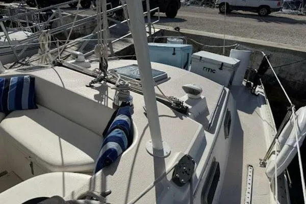 Slide: The Image of 1989 Catalina Morgan 440 sailboat deck with seating and nautical equipment. - 20