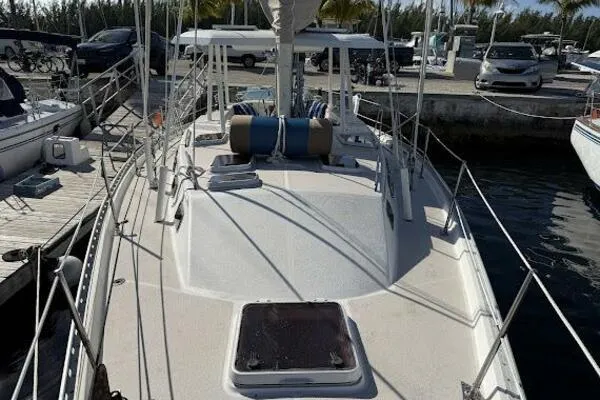 Slide: The Image of 1989 Catalina Morgan 440 sailboat docked at marina, view of deck and rigging. - 32