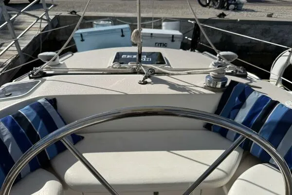 Slide: The Image of Cockpit view of 1989 Catalina Morgan 440 sailboat with striped cushions. - 37