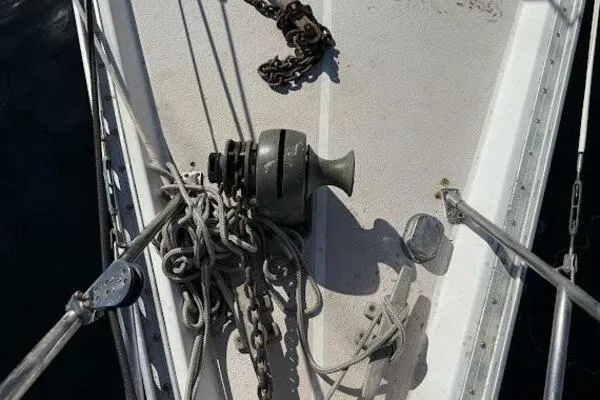 Slide: The Image of Deck of 1989 Catalina Morgan 440 sailboat with anchor winch and chains. - 38