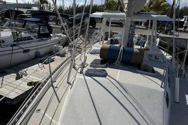 Slide: The Image of 1989 Catalina Morgan 440 sailboat docked, featuring spacious deck and rigging. - 39