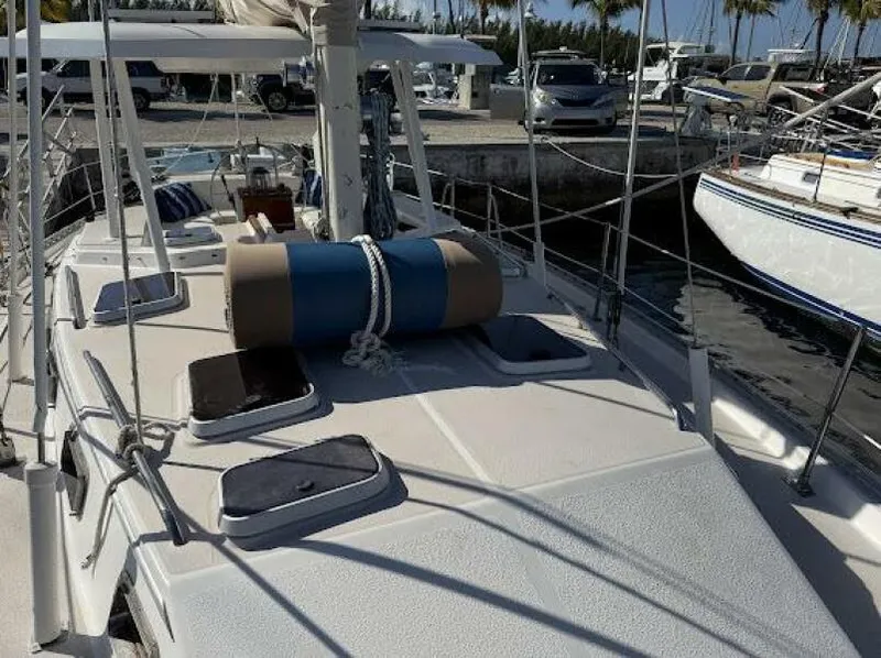 Slide: The Image of 1989 Catalina Morgan 440 sailboat deck with equipment, docked at marina. - 40