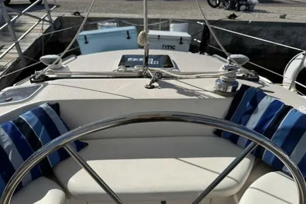 Slide: The Image of Cockpit view of 1989 Catalina Morgan 440 sailboat with striped cushions. - 44