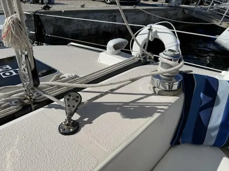 Slide: The Image of Close-up of 1989 Catalina Morgan 440 sailboat deck with winch and ropes. - 45