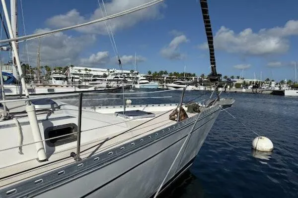 Slide: The Image of Catalina Morgan 440 sailboat docked in marina, 1989 model, under clear blue sky. - 6